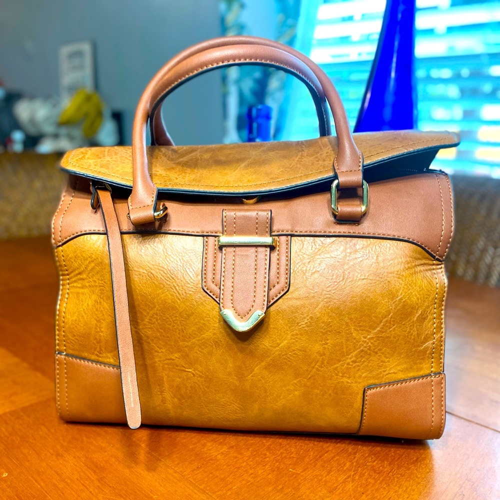 Brown duffle purse. No name leopard inside lining.